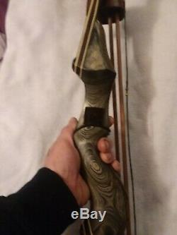 60lb Rh Black Hunter Recurve Bow Pkg barely used. With extras